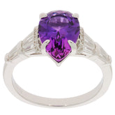 Pear purple amethyst sterling silver ring with accent stones, showcasing elegant design and brilliant gemstone.