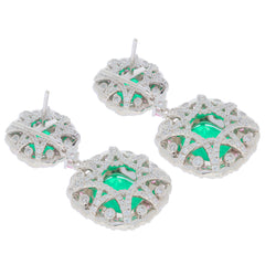 Cushion green emerald sterling silver earrings with sapphire accents, elegantly designed for luxury and sophistication.