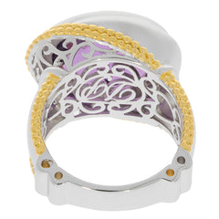 Oval purple amethyst sterling silver ring with elegant gold accents and detailed filigree design.