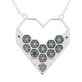 Blue diamond sterling silver heart necklace with sparkling gemstones, perfect for elegant style and luxury.