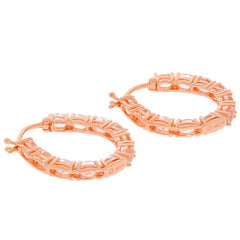 Elegant rose gold hoop earrings featuring intricate cut-out designs for a stylish accessory.