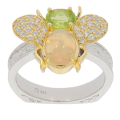 Elegant floral-inspired ring featuring green Peridot, opal, and sparkling accents in sterling silver and gold.