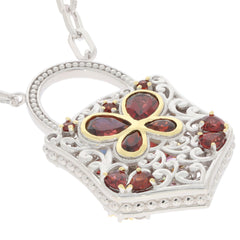 Multiple color sapphire and garnet sterling silver pendant with intricate floral design.