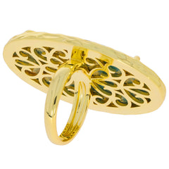 Gold oval ring with intricate design, featuring turquoise stone, ideal for luxurious fashion statements.