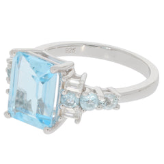 Blue Topaz sterling silver ring with accent gemstones, showcasing elegance and luxury in fine jewelry.