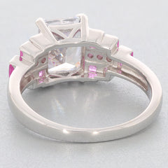 Back view of elegant Emerald White Moissanite ring with pink accent stones set in sterling silver.