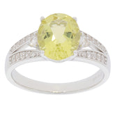 Oval yellow Heliodor sterling silver ring with accent stones, showcasing elegant design and luxury.
