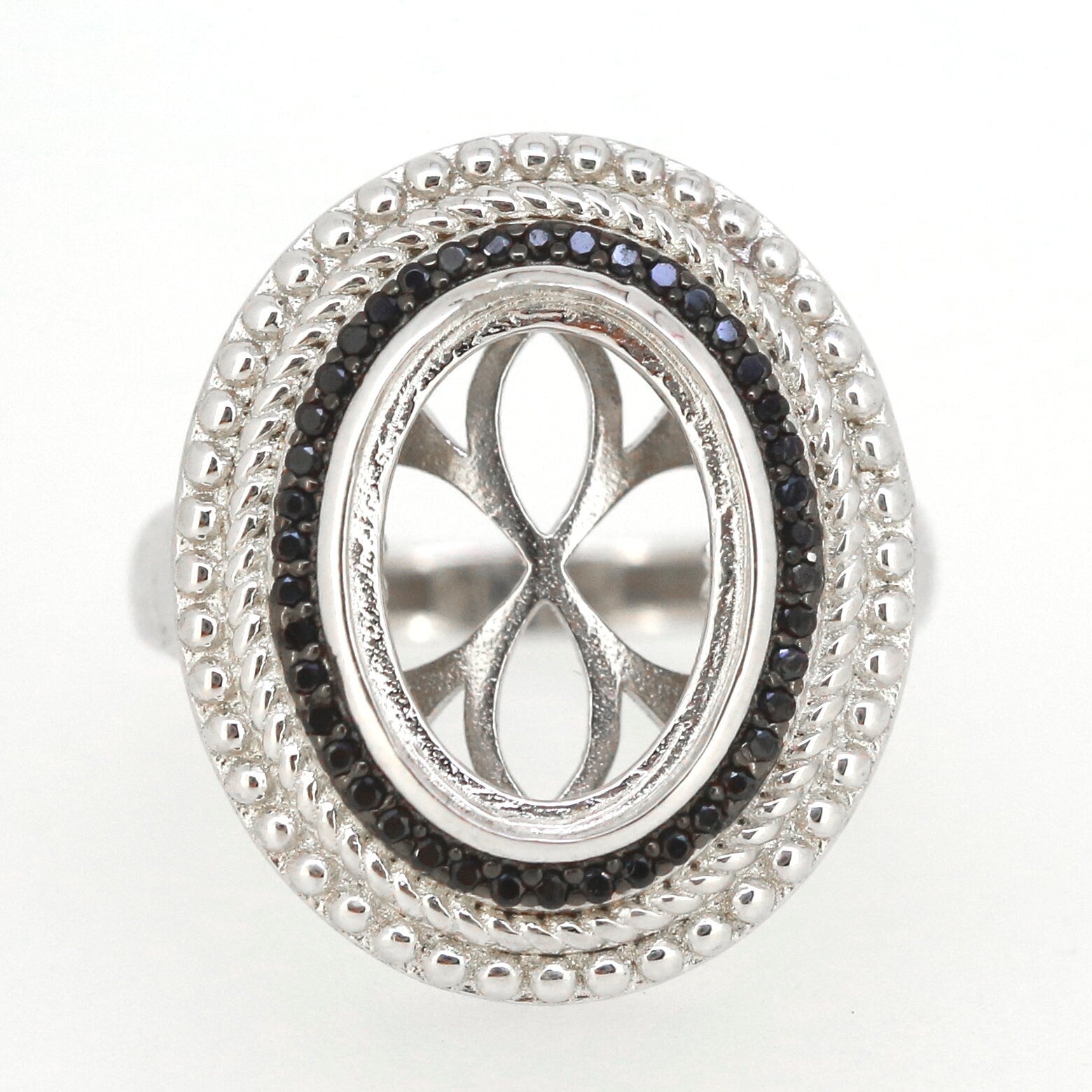 Sterling silver semi mount ring setting with oval cabochon design, halo milgrain detail and black spinel gemstones.