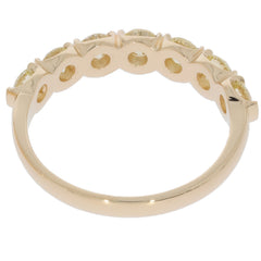 14K yellow gold ring with round green diamonds, showcasing intricate design and elegance from the side view.