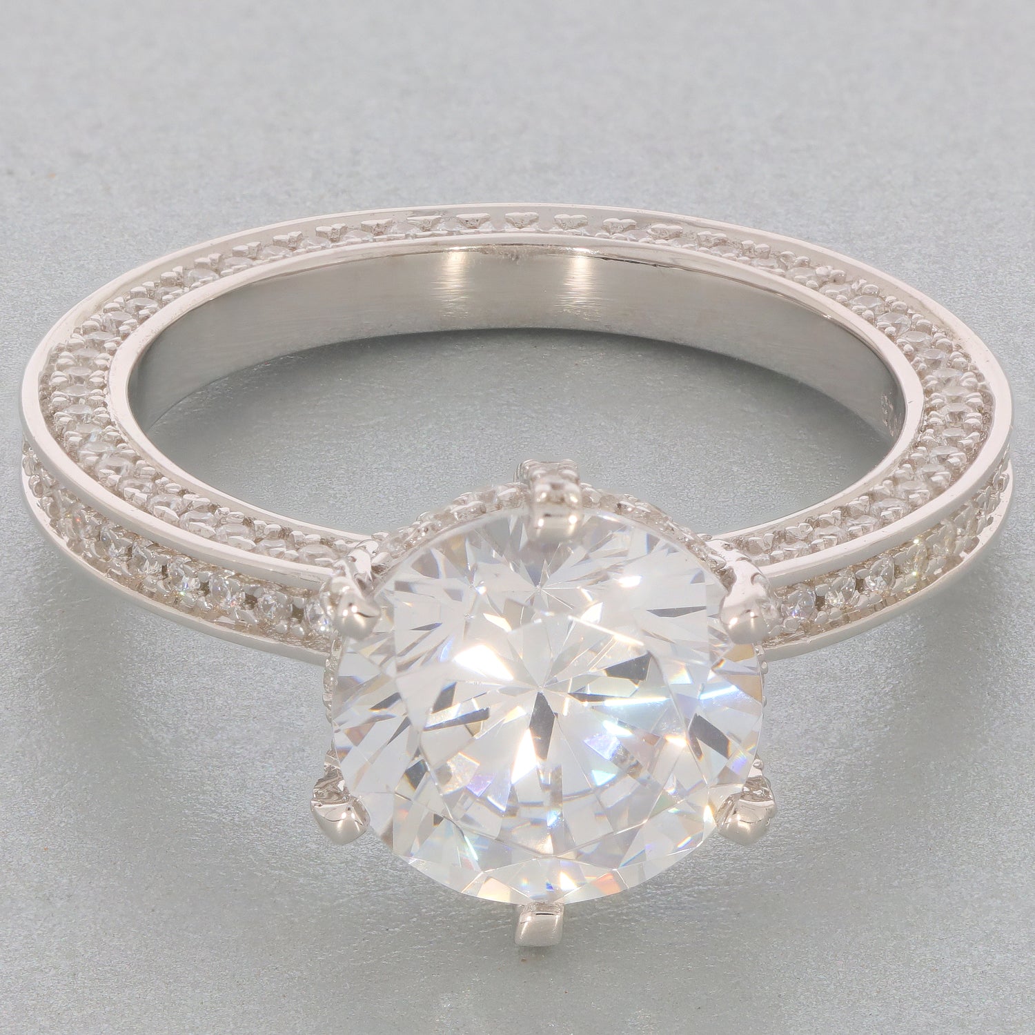 White Moissanite sterling silver ring showcasing a brilliant gemstone and elegant band design.