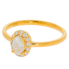 Elegant gold ring featuring an oval diamond center stone surrounded by smaller accent diamonds.