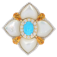 Elegant floral ring featuring turquoise center, surrounded by white and yellow gemstones for a luxurious look.