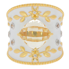Elegant gold and white statement ring with floral accents and a large central gem, perfect for sophisticated styles.