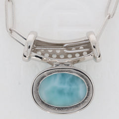 Oval blue Larimar Pectolite sterling silver pendant showcasing a sparkling gemstone, perfect for elegant fashion.