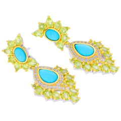 Elegant pear blue turquoise sterling silver earrings adorned with vibrant green gemstones and sparkling accents.