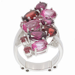 Elegant sterling silver ring featuring red and pink gemstones in an intricate design, perfect for a sophisticated look.