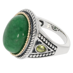 Oval green jadeite sterling silver ring featuring a sparkling accent gemstone. Elegant jewelry piece for sophisticated style.