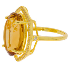Elegant yellow citrine ring in sterling silver setting with sparkling accents, perfect for adding luxury to any outfit.