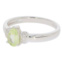 Green Peridot 14K White Gold Ring with Diamond Accent, elegant jewelry piece with sparkling gemstone.