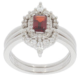 Emerald red garnet sterling silver ring with accent diamonds, showcasing elegant gemstone design and luxurious style.
