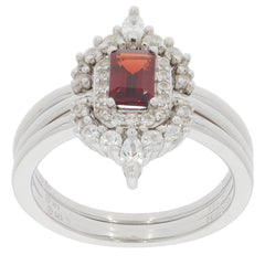 Emerald red garnet sterling silver ring with accent diamonds, showcasing elegant gemstone design and luxurious style.