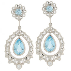 Elegant pear blue topaz sterling silver earrings with intricate design and sparkling accents.