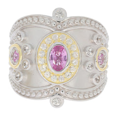 Elegant sterling silver ring featuring a central pink sapphire surrounded by sparkling diamonds and gold accents.
