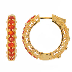 Round orange sapphire hoop earrings in gold with intricate detailing and sparkling accents.