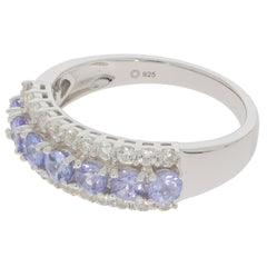 Blue Tanzanite sterling silver ring with sparkling accents, featuring elegant gem settings and a polished finish.