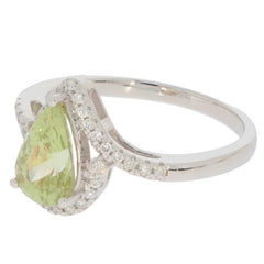 Green Peridot pear-shaped ring in 14K white gold with diamond accents, showcasing elegance and luxury.