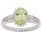 Elegant Green Peridot ring set in 14K white gold with diamond accents, showcasing luxury and sophistication.