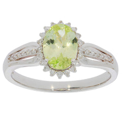 Elegant Green Peridot ring set in 14K white gold with diamond accents, showcasing luxury and sophistication.