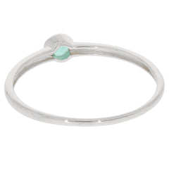 Round green emerald sterling silver ring with a minimalist design, showcasing sparkling gemstone accent.