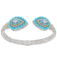 Elegant Pear Blue Topaz Sterling Silver Bracelet with Turquoise Accents, featuring a luxurious design.