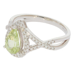 Elegant Green Peridot 14K White Gold Ring with sparkling diamond accents, featuring a pear-shaped gemstone.
