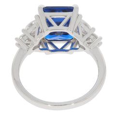 Emerald blue sapphire sterling silver ring showcasing a stunning gemstone with an elegant design and intricate detailing.