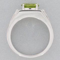 Round green peridot sterling silver ring showcasing the sparkling gemstone from above.