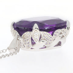 Purple Amethyst sterling silver pendant featuring a sparkling gemstone and intricate design.