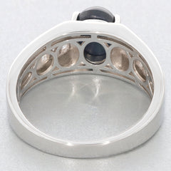View of the interior design of an oval black spinel sterling silver ring with intricate detailing.