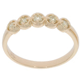 Round diamond band ring in 14K yellow gold, featuring five sparkling diamond accents for elegant style.