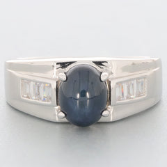 Oval black spinel sterling silver ring with accent gemstones, showcasing elegant design and luxurious shine.