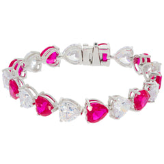 Heart pink sapphire sterling silver bracelet with moissanite accents, elegantly designed for a luxurious look.