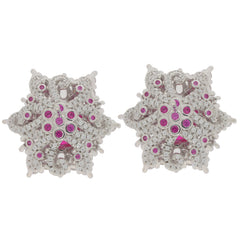 Oval pink sapphire sterling silver earrings with ornate design and sparkling gemstones for elegant style.
