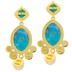 Cushion Blue Turquoise Sterling Silver Earrings with gold accents, showcasing elegant design and sparkling gemstones.