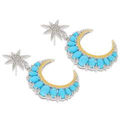 Elegant oval blue turquoise sterling silver earrings with topaz accents and star design.