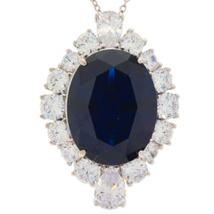 Oval blue sapphire sterling silver pendant surrounded by sparkling gemstones, perfect for elegant occasions.