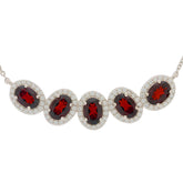 Elegant Oval Red Garnet Sterling Silver Necklace with sparkling accents, perfect for sophisticated style.