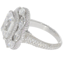 Emerald white moissanite sterling silver ring with sparkling accents, showcasing luxury and elegance.