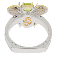 Sterling silver ring featuring an 8X6 green peridot gemstone with elegant butterfly design and accent details.