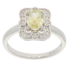 Yellow Sapphire ring in 14K white gold with diamond accents, showcasing an elegant floral design.